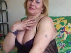 Chubby mature fingering and playing with herself