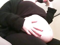 Plump feedee bloats her belly with soda